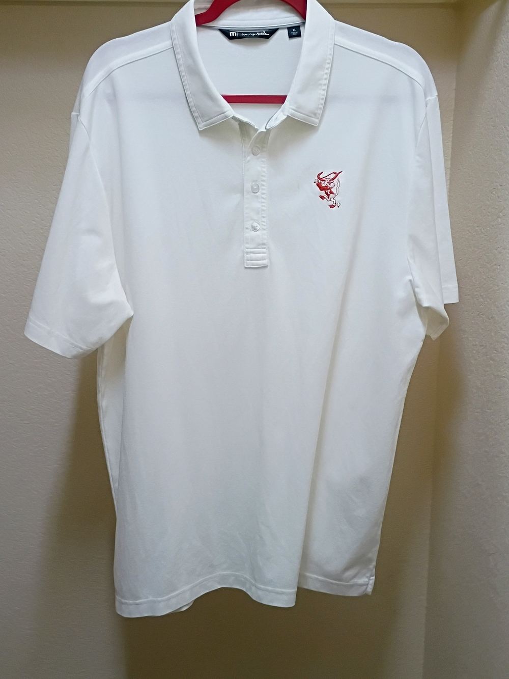 Travis Mathew White Polo with Red Embroidered Logo